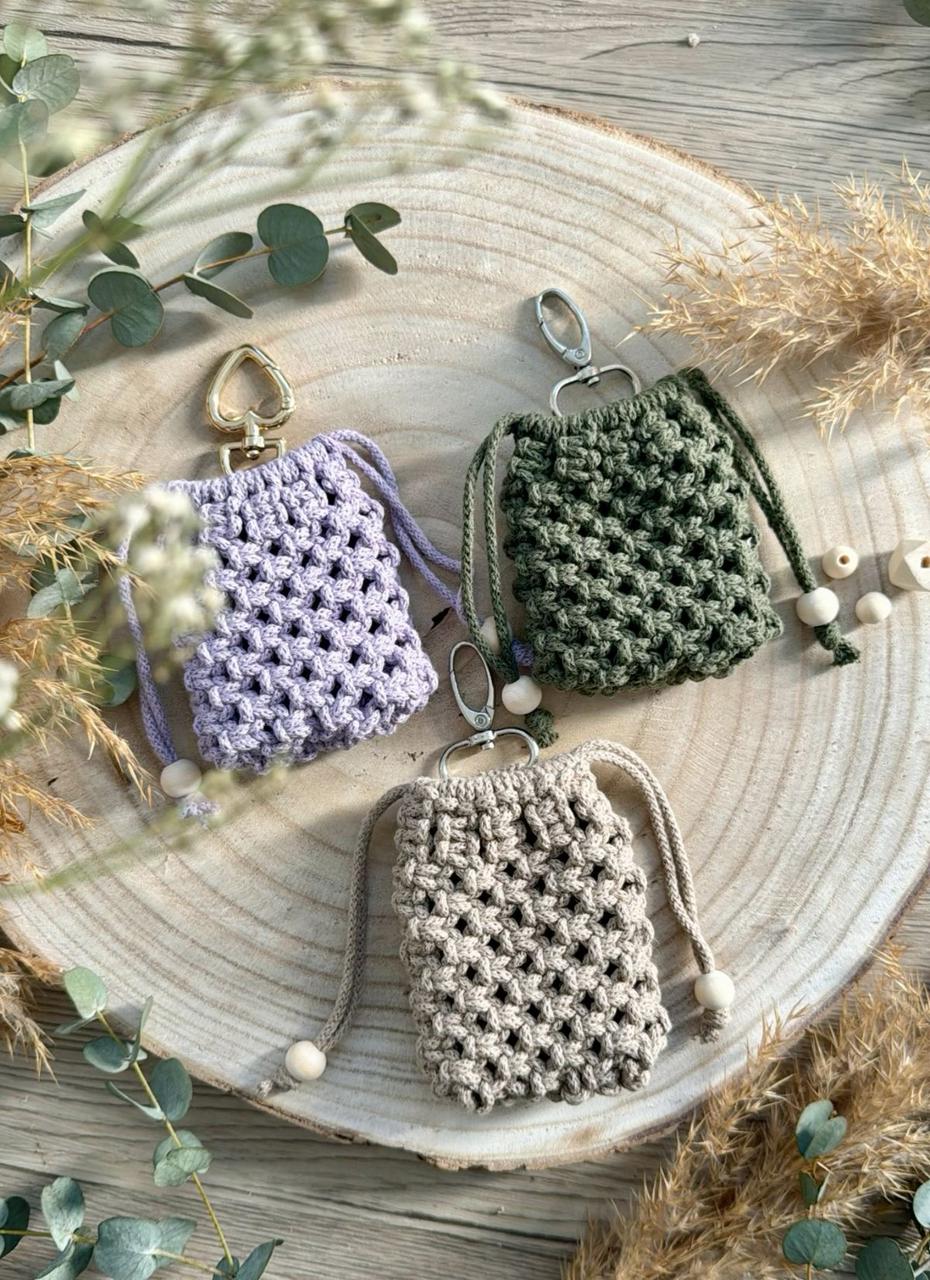 Three macramé mini pouches with bead drawstrings